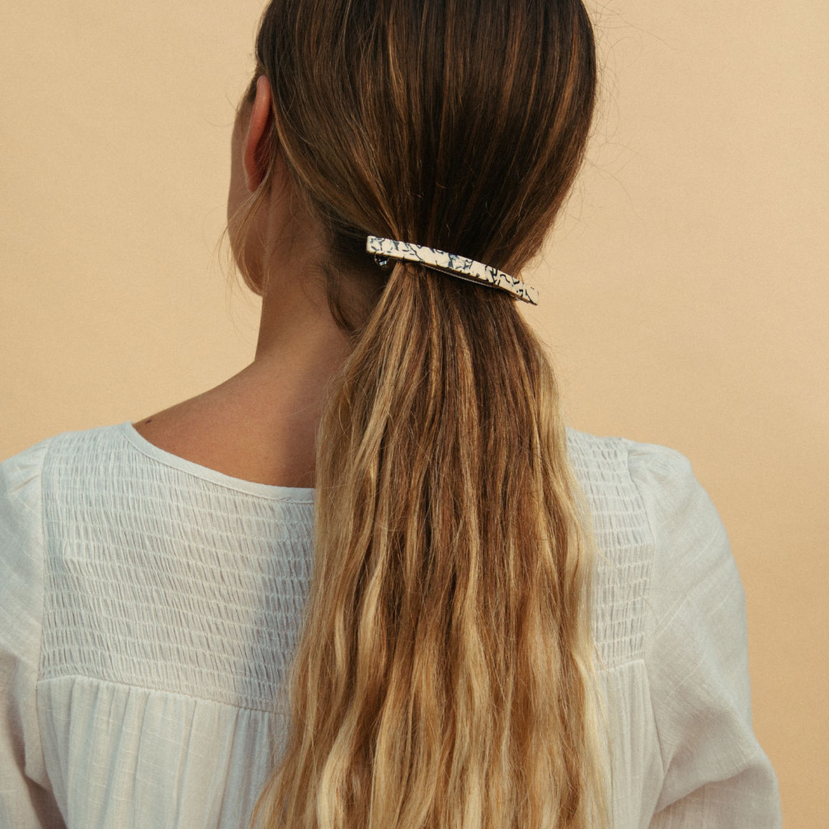 Shop Nat + Noor’s classic French barrette in acetate material. NAT + NOOR
