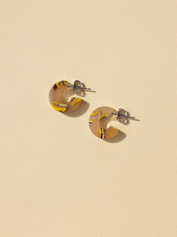 neutral hoop earrings with pops of yellow